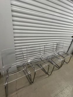 4 IKEA Tobias chair with a clear acrylic seat and chrome-plated legs