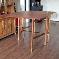 Mid-century modern expandable dining table.