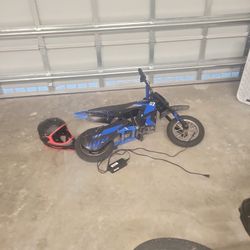 A Dirt Bike Comes With Charger And Gose Up To 14 Mils Per Hour For Kids And Helmet 
