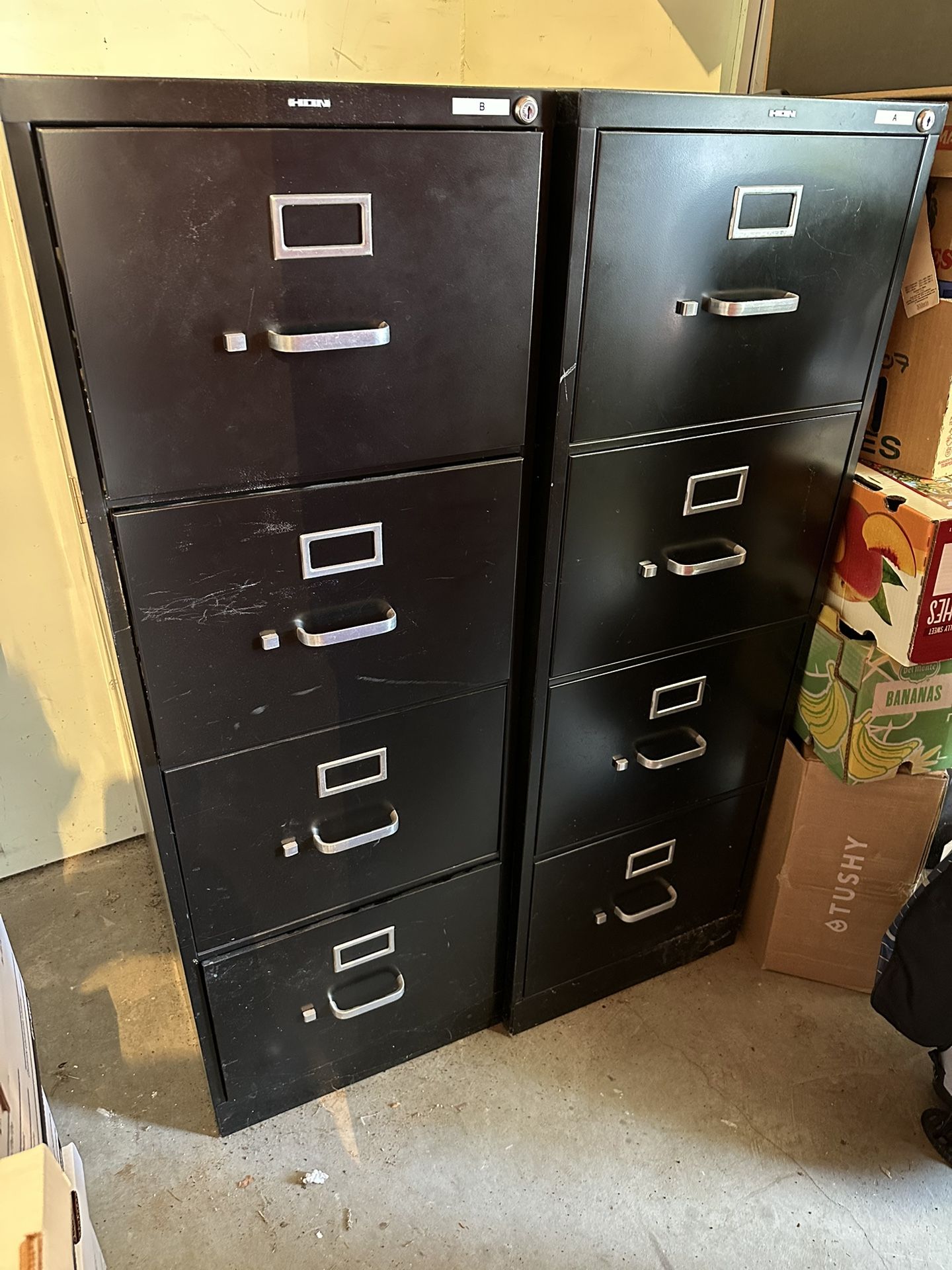 Two Legal Size Four Drawer Filing Cabinets