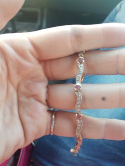 .925 bracelet gold plated. Rubies I believe.
