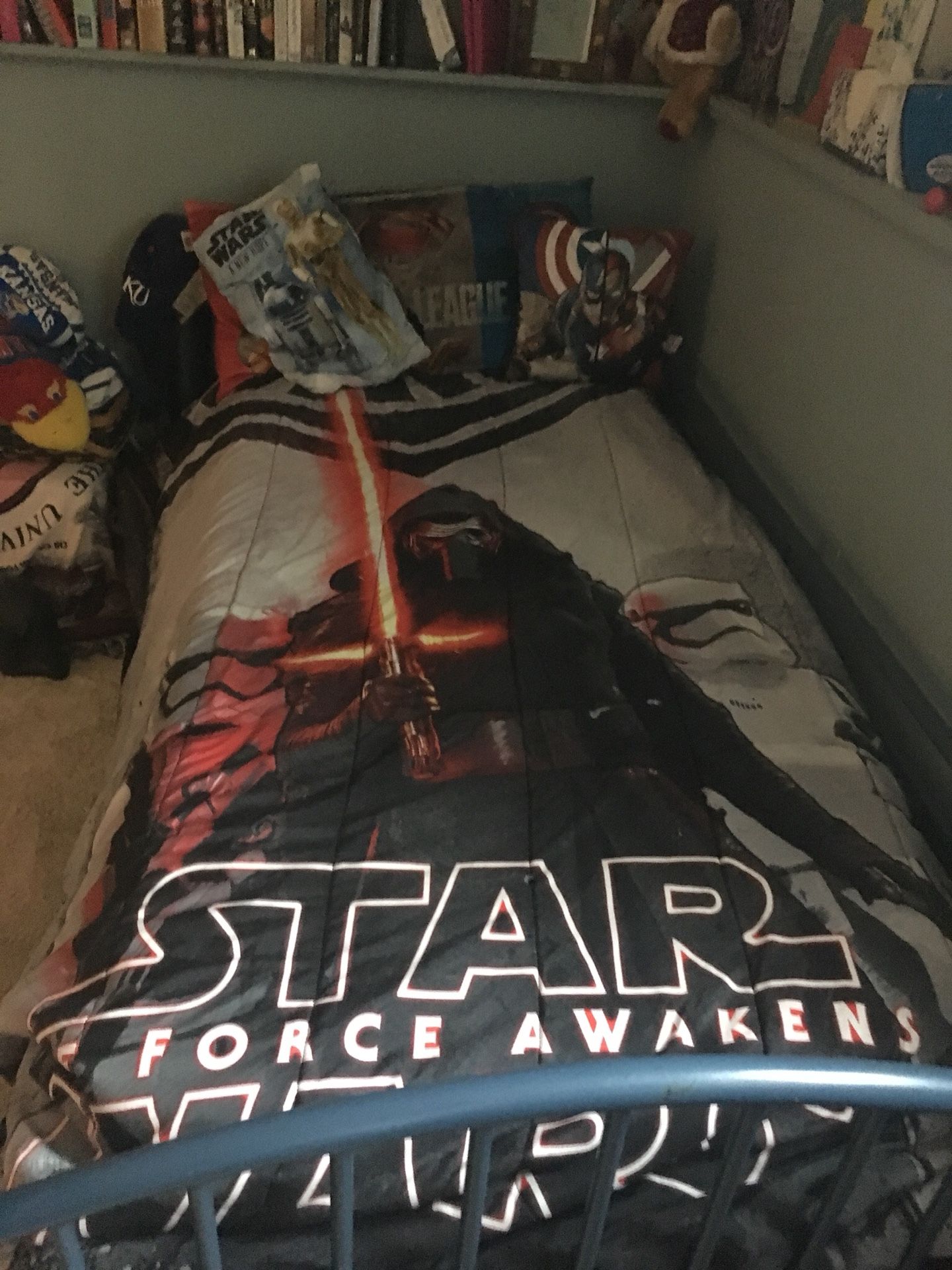 Star Wars Twin Bed Set with a black fitted and black regular sheet. Reversible Star Wars comforter, along with two Star Wars pillow shams. Also inclu