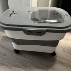 A storage bucket with a spoon