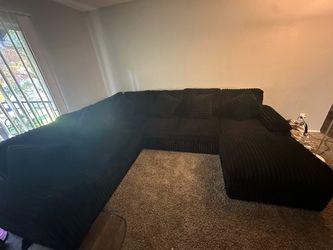 Black u shaped sectional sofa with storage chaise