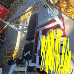 OLYMPIC WEIGHT BENCH  LEG EXTENSION  ADJUSTABLE INCLINE  AND  BAR HEIGHT.   7'  45LB BAR  WITH CLIPS 
11525 S  HALSTED DUNKIN DONUTS/7111.S WESTERN WA