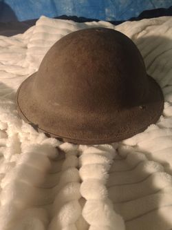 War I-era U.S. M1917 "Brodie" steel helmet,