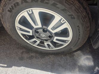 2021 Toyota tundra OEM rims with 285 65 20 GoodYear tires.