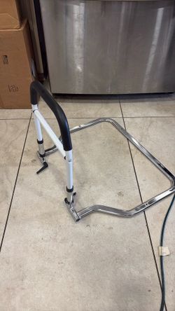 Adjustable bedside safety rail