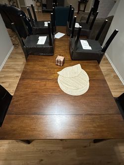 Wood Dining Table with 8 Black Chairs