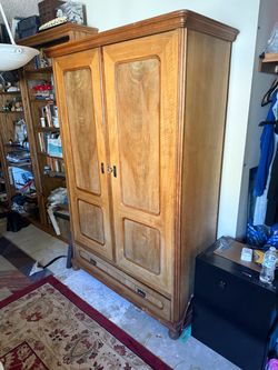 Large Wooden Armoire with Bottom Drawer