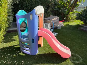 Outdoor play structure with slide