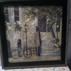 Framed vintage wall art print made in Canada featuring a European street with bicycle