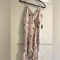 Express gorgeous light pink wedding guest sundress with cream floral print size M with hidden zipper in back. Includes removable sash. Has a built in 