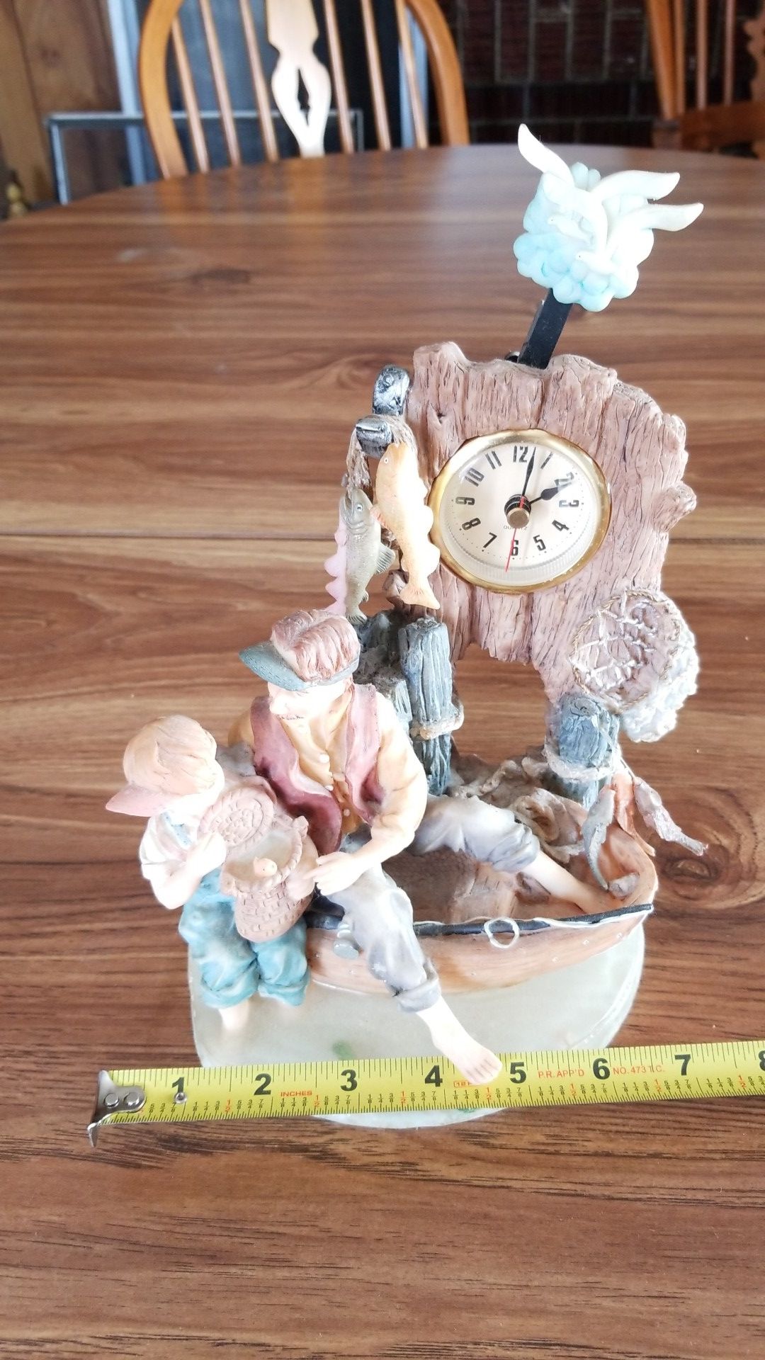 Father and son fishing clock