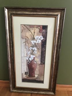 White flower in red vase painting in brown wooden frame