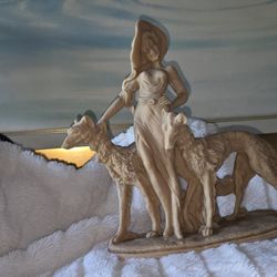 Vintage.
Lady and hound statue
