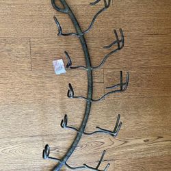 Dark grey metal wall wine rack