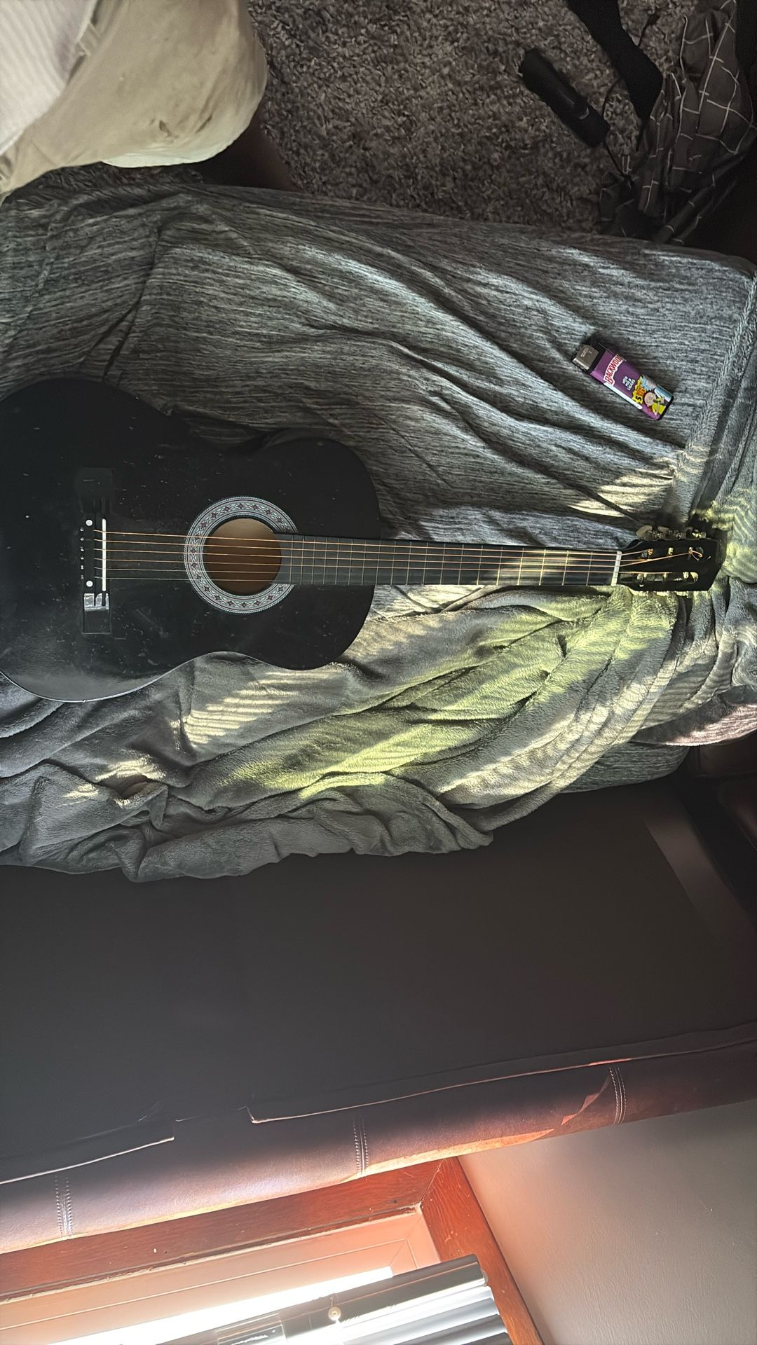 A black beginners guitar