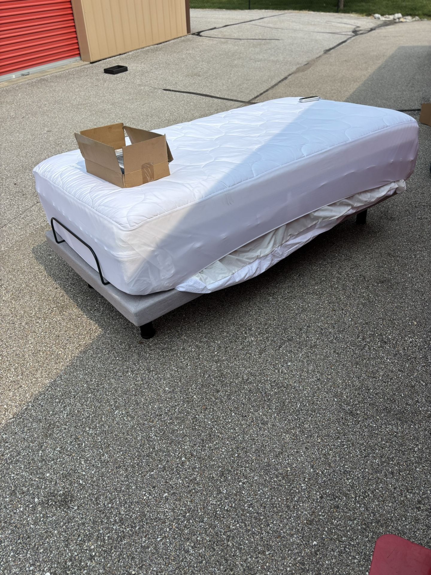 New (XL Twin Bed With New Pillow Top Mattress and Twin Bed With a Remote
