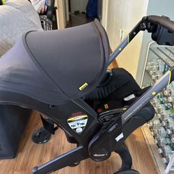 Doona Stroller With Extra Accessories