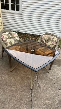 Outdoor chairs and glass table