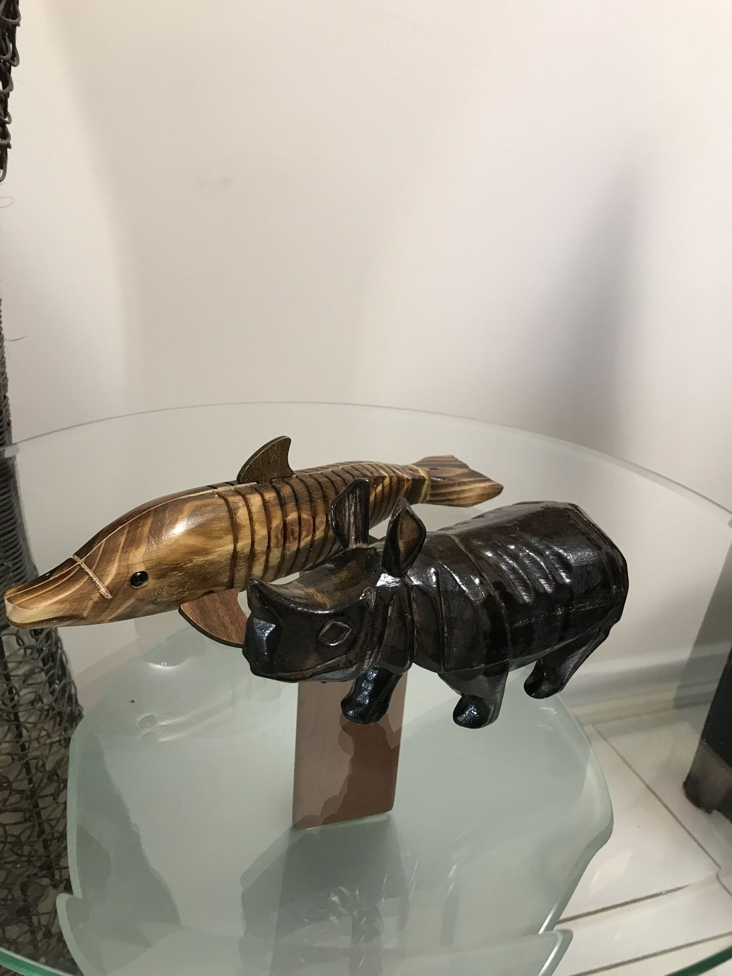 Gorgeous Hand Carved And Hand Painted Wooden Animal Figurines. Fish is 12.5 inch L and 3.5 inch H and a Rhinoceros L -8 inch and H- 4.5 inch.