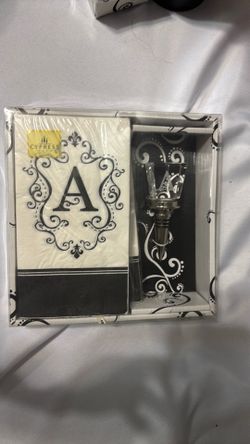 A monogram set with napkins and wine stopper