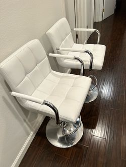 Pair of White Tufted Faux Leather Bar Stools