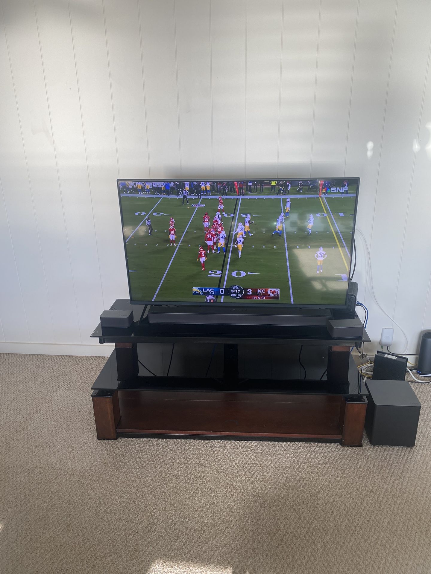 Insigniaw 50-inch 4K QLED Fire TV, Vizio 5.1 M-Series Sound Bar, and Entertainment Center