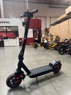 Front and rear shock-absorbing electric scooters