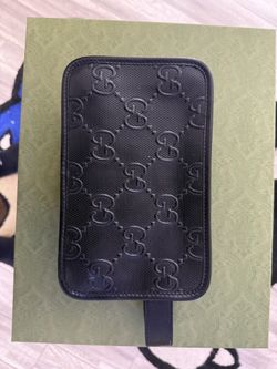 Gucci Black Embossed GG toiletry bag $550