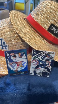 One Piece Luffy 2025 and Don 2026 Dodger cards with 2 hats