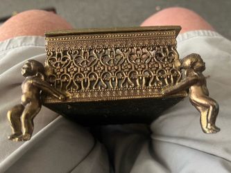 Vintage jewelry box with cherub legs
