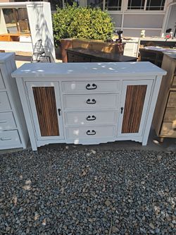 Solid wood freshly sanded and painted four drawer dresser with two storage areas behind doors on each end with adjustable shelves in real rustic wood 