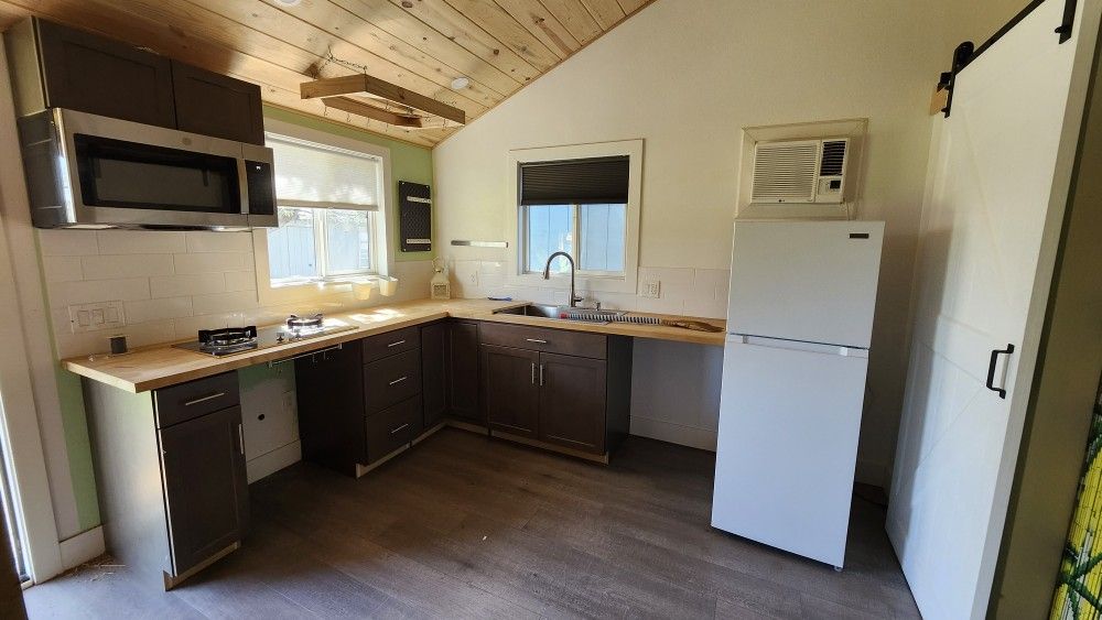 Kitchen Cabinets, Counter Tops Fridge, Microwave,and 2 burners Top Stove,sink, Faucet Everything