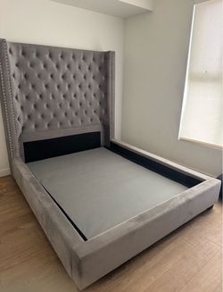Gray vintage queen, size bed, and couch