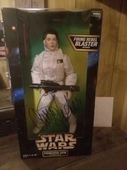 Star wars action figure. Carrie Fisher autograph.