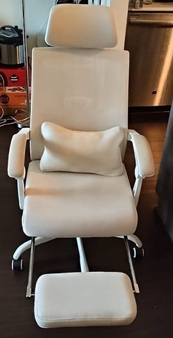 Off white desk chair with leg rest