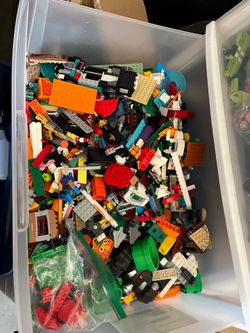 Plastic drawers filled with Legos take the  all