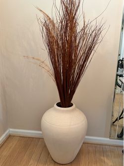 Large decorative price vase with sticks