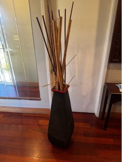 Vase with bamboo sticks