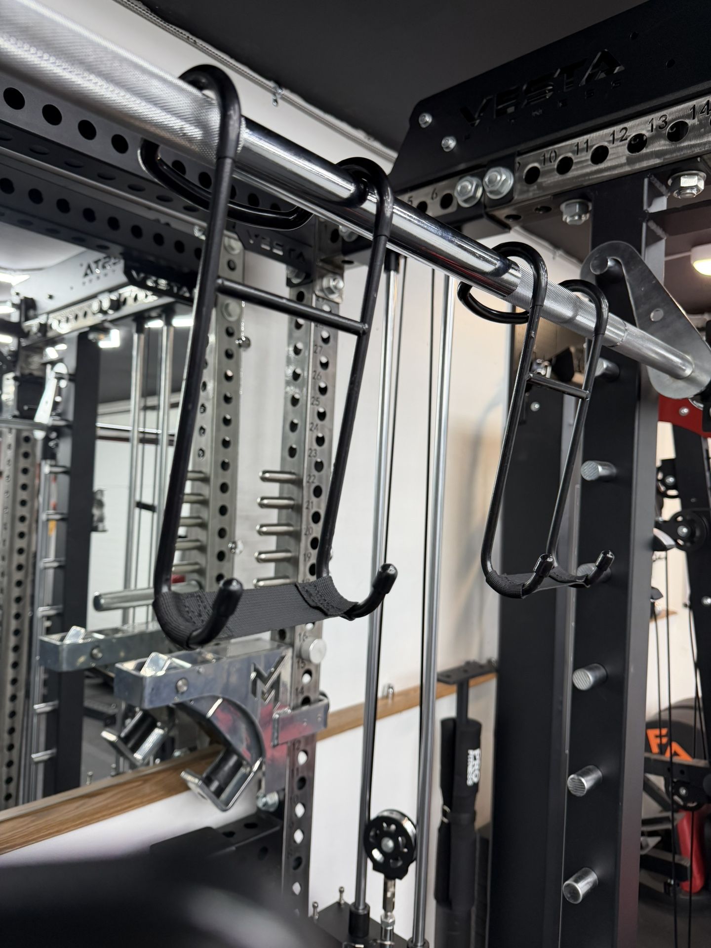 Dumbbell spotter hook