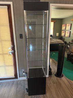 Glass Case Cabinet with Light and Key Lock. 5 Glass shelves. Black and silver. Perfect for displays!