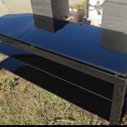 TV Stand with smoked glass shelves.