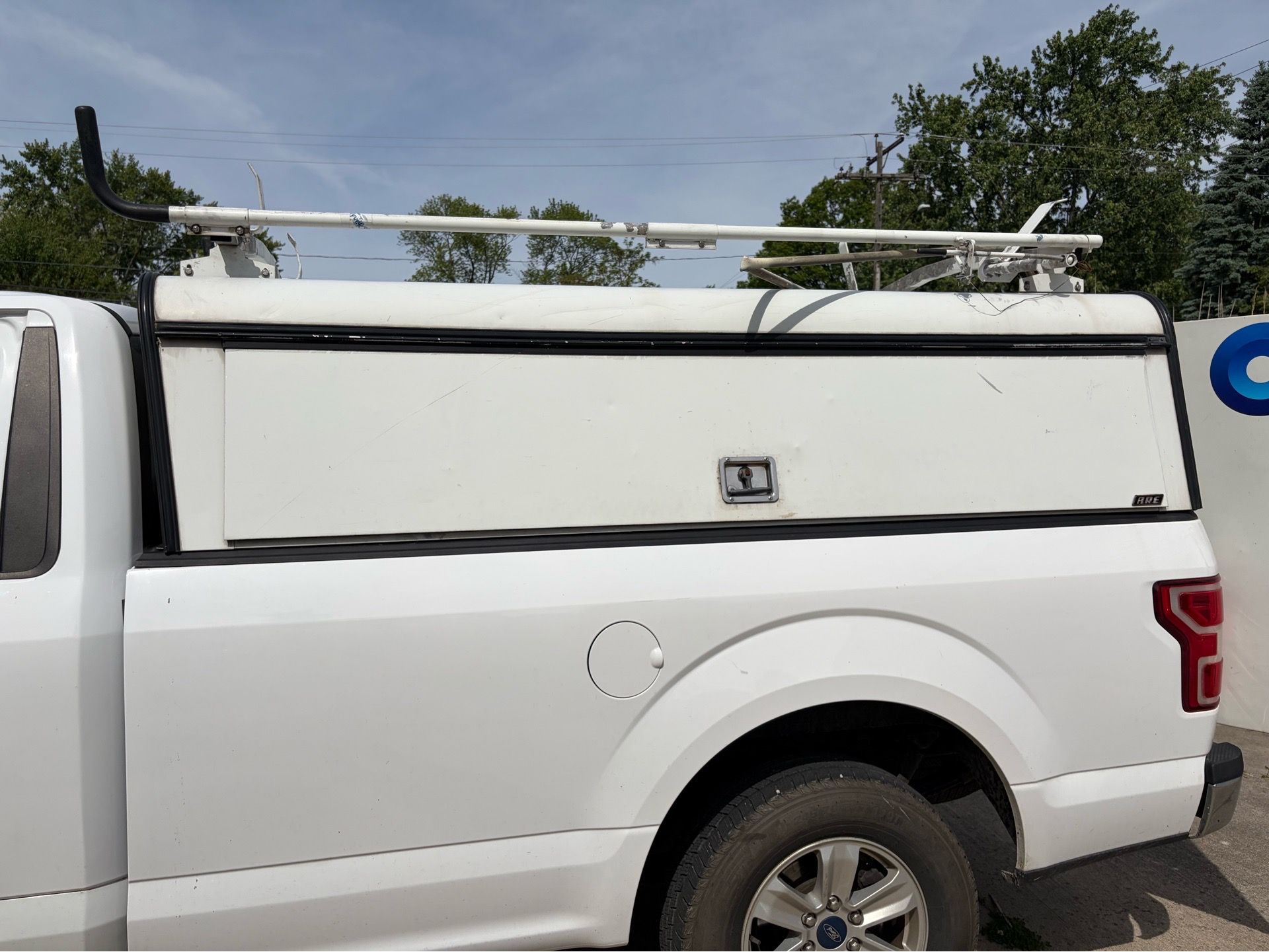 8ft A.R.E. DCU Commercial Truck Cap w/ Prime Design ErgoRack Drop-Down Ladder Rack
