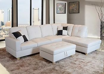 New white leather sectional and ottoman