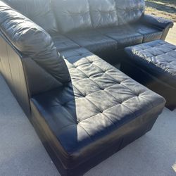 Brown black sectional sofa and ottoman  