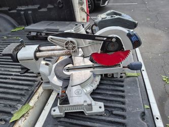 Kobalt 10-Inch Bevel Sliding Compound Miter Saw equipped with a red saw blade