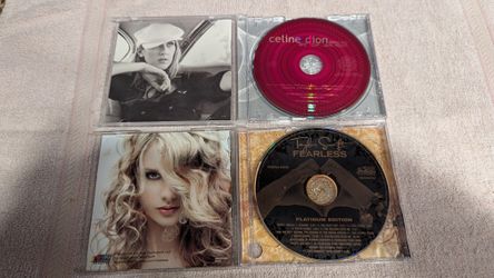 Taylor Swift Fearless and Celine Dion One heart . D VD's