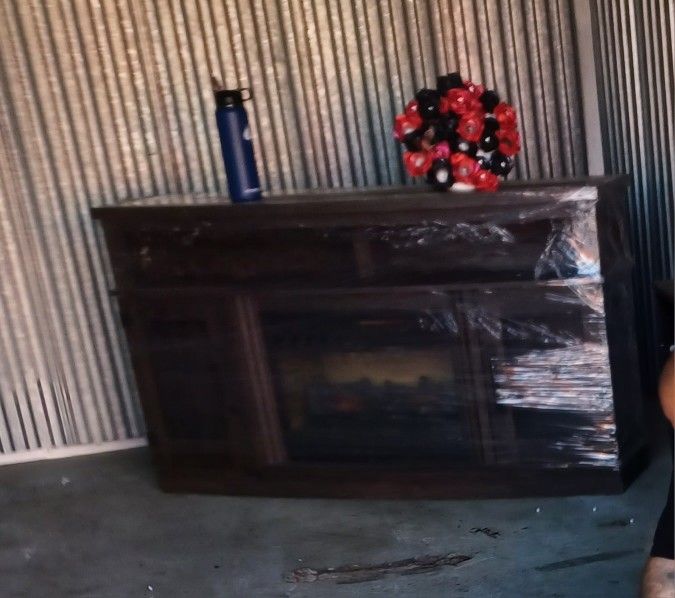 Cabnit With Fire Place In It